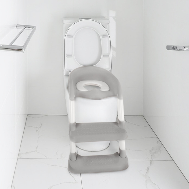 réducteur de toilette gris et blanc imprimé animaux